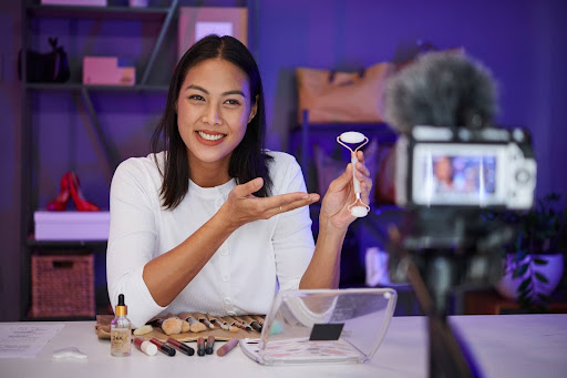A beauty influencer showcases a new skincare product on camera