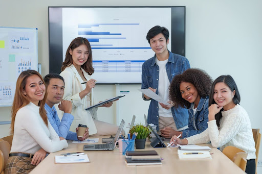 The diverse and collaborative team at our press release agency in Singapore during a strategic planning session for a client campaign